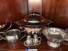 Contents of shelf: pewter serving pcs