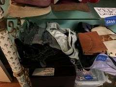 Contents of three shelves: ladies hats and purses, baseball caps,