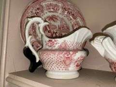 Contents of shelf: red Staffordshire transfer printed china teapot, sugar & creamer, plates