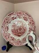 Contents of shelf: red Staffordshire transfer printed teapot, cup plates, plates