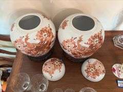 Pair porcelain ginger jars w/ peacock decor, on wooden bases