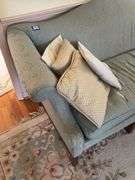 Camel back sofa and throw pillows - note upholstery shows wear - flag not included 72in long