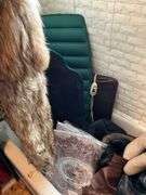 Contents of bathroom except fur coats: collectibles, health items, boots, cleaning supplies, misc