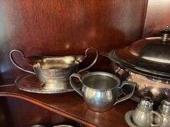 Contents of shelf: pewter serving pcs