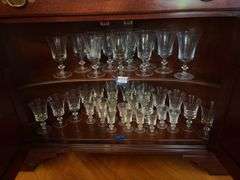 Contents of two shelves: glass stemware set