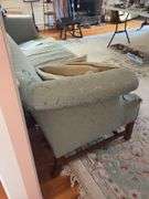 Camel back sofa and throw pillows - note upholstery shows wear - flag not included 72in long