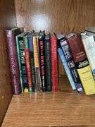 Book contents of four shelves: Bibles, golf, reference, misc