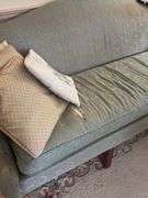 Camel back sofa and throw pillows - note upholstery shows wear - flag not included 72in long