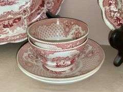 Contents of shelf: red Staffordshire transfer printed china including White Mountain NH scene and Columbus