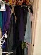 *In living room* Contents of closet: ladies jackets sz: lg/16, tablecloths and linens lot