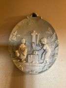 Wall hangings: oval gilt mirror 18x16, and bisque plaque w/ figures in relief
