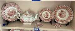 Contents of shelf: red Staffordshire transfer printed teapot, cup plates, plates