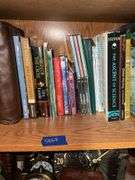 Book contents of four shelves: Bibles, golf, reference, misc