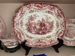 Contents of shelf: red Staffordshire transfer printed platter and plates, including British Lakes pattern