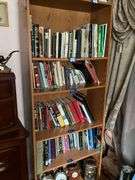Book contents of four shelves: Bibles, golf, reference, misc