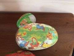 Three cardboard Easter egg candy containers