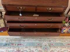 Slant front desk w/ compartmented interior w/ seashell inlaid prospect door, graduated drawers w/ inlaid escutcheons, ogee bracket feet  50x21x43