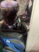 Golf clubs in bag, golfing Santa figure, golf accessories and decor items