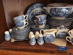 Contents of two shelves: Liberty Blue Historic Colonial Scenes dinnerware set w/ serving pcs