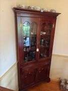 Mahogany corner cupboard w/ molded cornice over glazed doors, drawer and cupboard base, w/ bracket feet - no contents 34.25x17x72 MUST COME DURING LAST 2 HOURS OF PICKUP FOR THIS ITEM