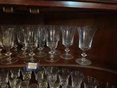 Contents of two shelves: glass stemware set