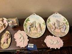 Collection of bisque plaques w/ cherubs and children in relief, and bisque match pocket