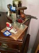 Smoking stand w/ pipe rest, matchbox holder and child's shoe, on wooden base