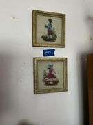 Wall hangings: milk glass Cupid & Psyche plate, bisque plaques, handpainted porcelain plates, two framed needlepoints