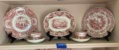 Contents of shelf: red Staffordshire transfer printed china including White Mountain NH scene and Columbus