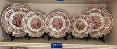 Contents of shelf: red Staffordshire transfer printed Spanish Convent pattern plates