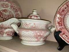 Contents of shelf: red Staffordshire transfer printed china teapot, sugar & creamer, plates