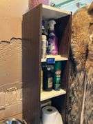 Contents of bathroom except fur coats: collectibles, health items, boots, cleaning supplies, misc