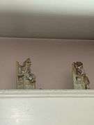 Contents of window cornice: bisque figurines, glazed planter