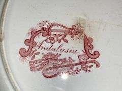 Contents of shelf: red Staffordshire transfer printed teapot, cup plates, plates