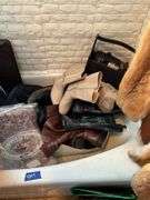 Contents of bathroom except fur coats: collectibles, health items, boots, cleaning supplies, misc
