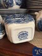 Contents of two shelves: Liberty Blue Historic Colonial Scenes dinnerware set w/ serving pcs