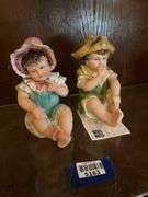 Two bisque piano baby figurines