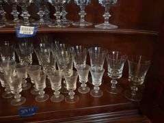 Contents of two shelves: glass stemware set