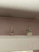 Contents of window cornice: bisque figurines, glazed planter