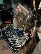 Corner desk and contents: desk accessoroies, CDs, brief cases, cables, misc