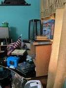 Corner desk and contents: desk accessoroies, CDs, brief cases, cables, misc