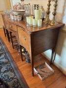 Federal style sideboard, cross banded top and fronts, inlaid ovals, square tapered legs, has bottle drawer - no contents 66x26x38 MUST COME DURING LAST 2 HOURS OF PICKUP FOR THIS ITEM