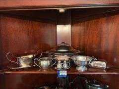 Contents of shelf: pewter serving pcs