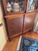 Federal style corner cupboard w/ central eagle finial, glazed top doors over cupboard base, inlaid stringing, French bracket feet - no contents 43x23x94 MUST COME DURING LAST 2 HOURS OF PICKUP FOR THIS ITEM