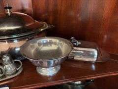 Contents of shelf: pewter serving pcs