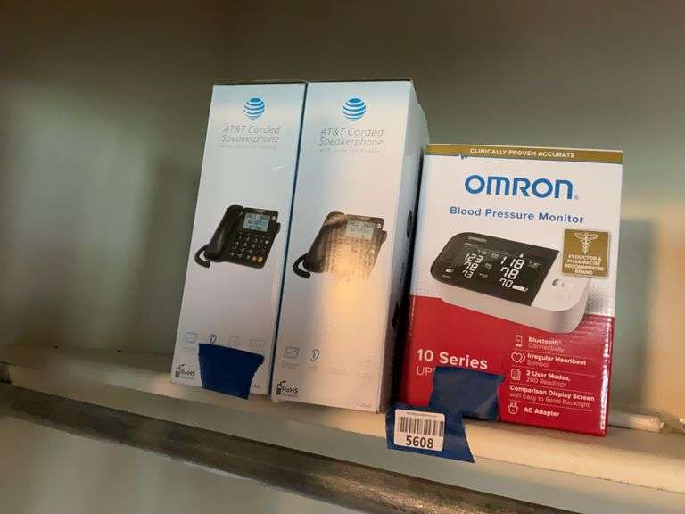 Two AT&T corded speaker phones in boxes, and Omron digital blood pressure monitor
