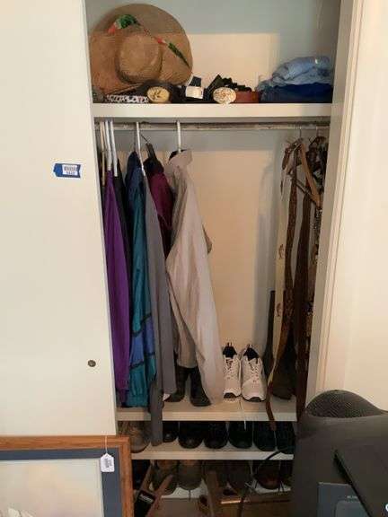 Contents of closet: clothing, shoes, boots, belts, shoe stretchers, misc