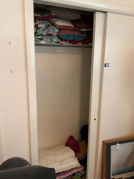 Contents of closet: afghans, throws, throw pillows, comforter