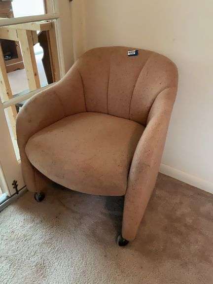 Rolling upholstered arm chair