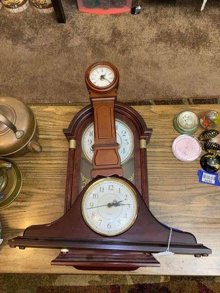 Three quartz shelf clocks